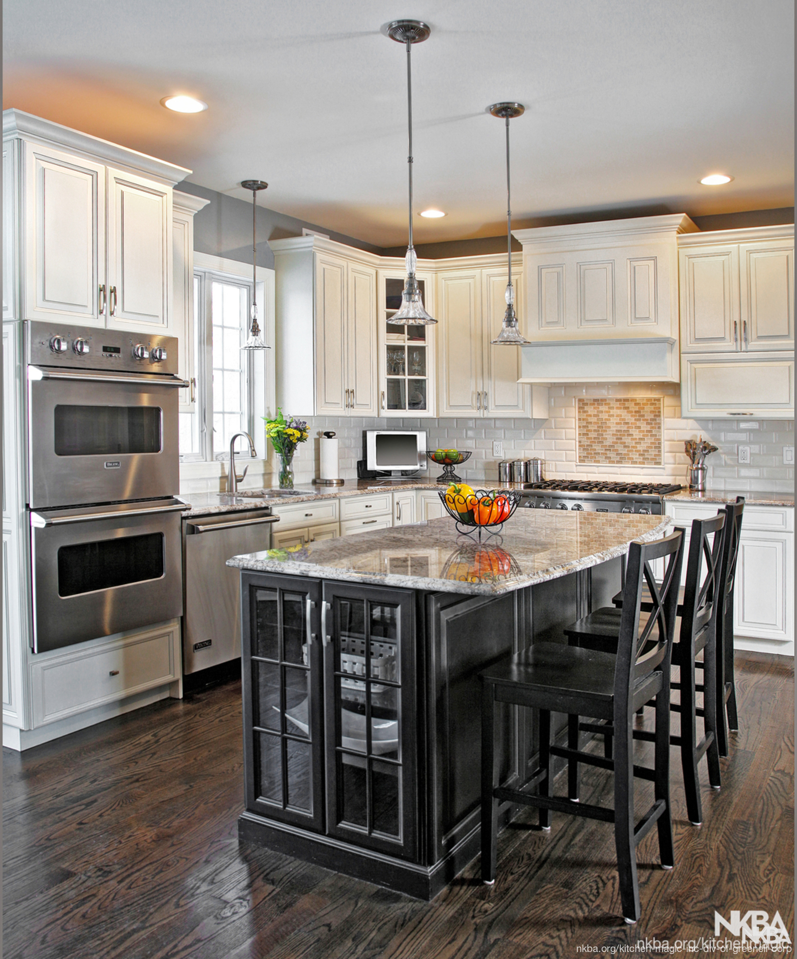 Ebony Black Island Surrounds By Antique White Cabinets Nkba